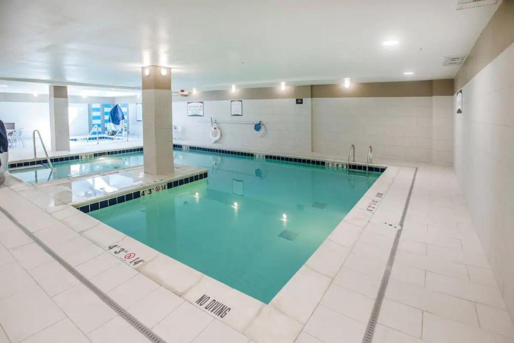 Staybridge Suites Denver Downtown by IHG large swimming pool with jacuzzi