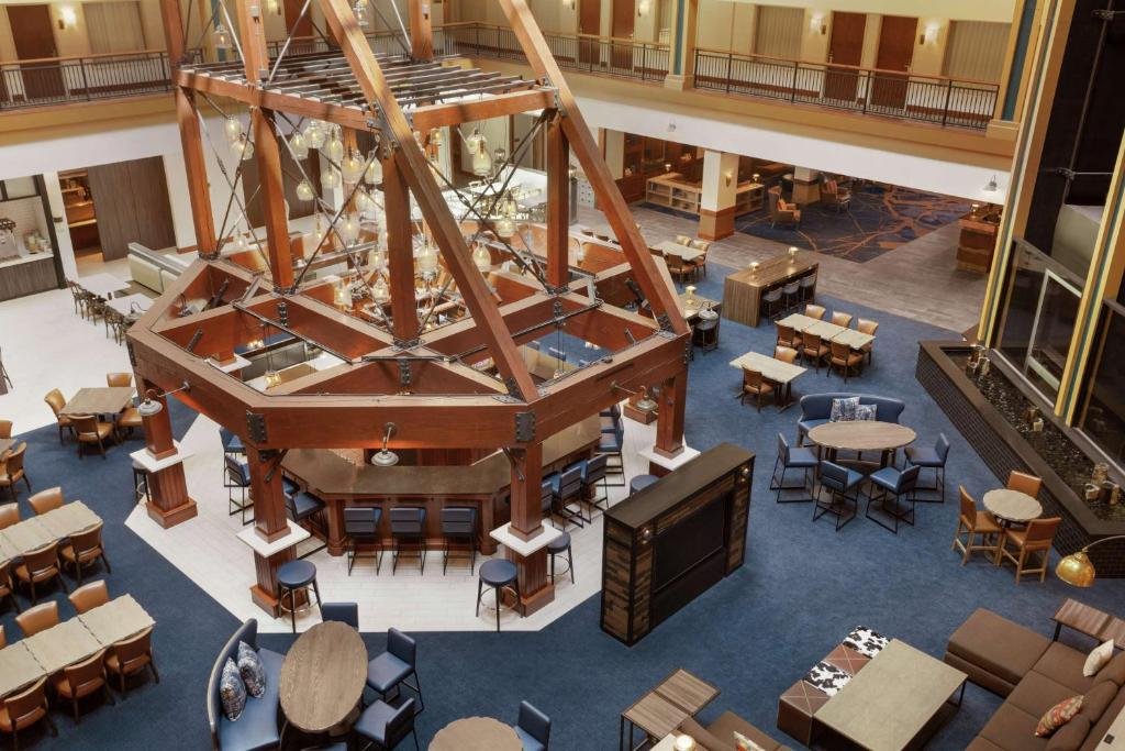 Embassy Suites by Hilton Denver International Airport large hall with blue carpet
