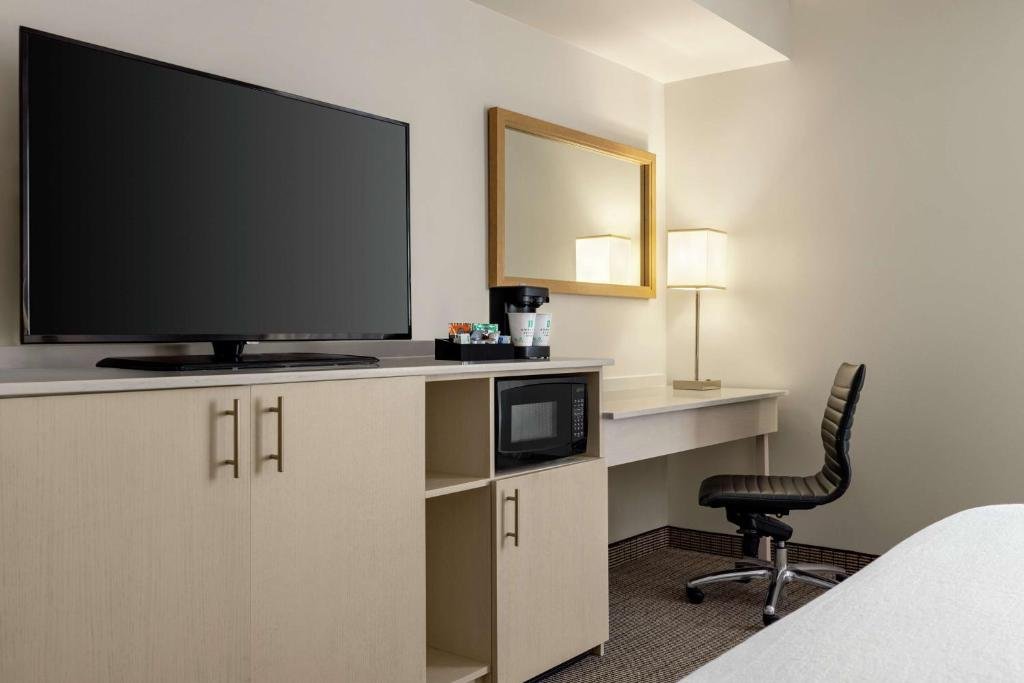Embassy Suites by Hilton Denver International Airport desk and TV