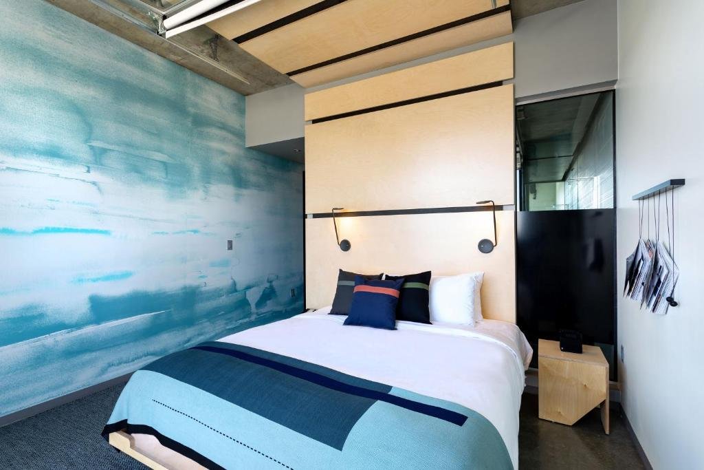 The Source Hotel Bedroom in holly tones